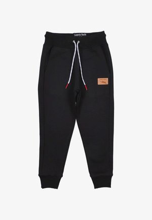 Schwarze Sweatpants aus weichem Stoff mit einem Kordelzugbund und kontrastierenden weißen und roten Details sowie einem Lederlogo-Patch.