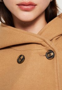Vero Moda Pitkä takki - beige