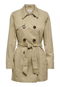 Trench-coat beige à double boutonnage, avec de gros boutons marron, une ceinture à la taille et des poches latérales. Texture du tissu lisse.
