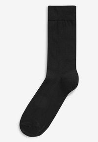Schwarze Socke aus Baumwollmischung. Verfügt über einen gerippten Bündchen und eine glatte Textur, mit einer abgerundeten Zehenpartie und verstärkter Ferse für Langlebigkeit.