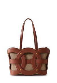 Brown leather tote bag with a textured beige fabric body, featuring circular cut-out accents and gold hardware. Adjustable shoulder straps.
