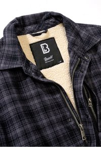 Mauve krāsas raibs žakets ar krēmkrāsas flīsa odere. Iezīmēts ar rāvējslēdzēja priekšpusi, apkakli un zīmola etiķeti iekšpusē. Izmērs M. Strukturēta auduma.