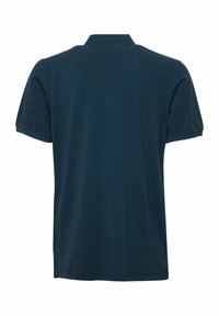 Polo-shirt bleu marine en coton doux, à manches courtes et col classique. Pas de logos ni de motifs visibles au dos.