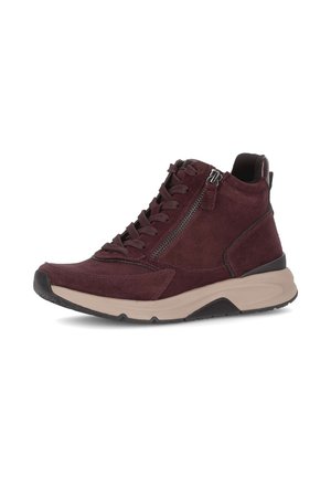 Burgundy suede sneaker with beige sole, lace-up front, side zipper, and black heel and toe accents, shown on a plain white background.