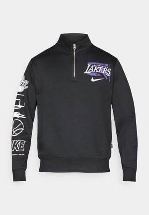 Zwarte Nike pullover trui met een kwart ritssluiting. Beschikt over een "Los Angeles Lakers"-grafiek in paars en wit, met extra graphics op de mouwen.