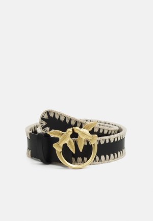 Black leather belt with beige stitched edges and a gold buckle featuring two birds facing each other forming a circle.