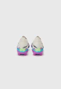 Football boots with a white upper, colorful gradient design in blue and green, and pink rubber studs. Features textured accents and branding.