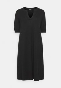 Abito nero fino al ginocchio con scollatura a V e maniche corte. Realizzato in un materiale morbido ed elastico, presenta una vestibilità comoda.