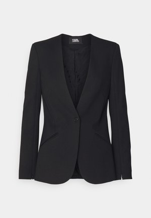 Zwarte blazer met een reverskraag, enkele knoopsluiting, twee voorkruimelzakken en een gladde stofstructuur. Beschikt over een gevoerde binnenkant.