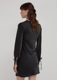 Calliope COURTE AVEC NŒUDS - Robe de jour - noir