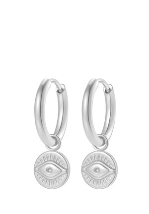 Pair of silver hoop earrings with round eye-shaped charms hanging from each hoop.