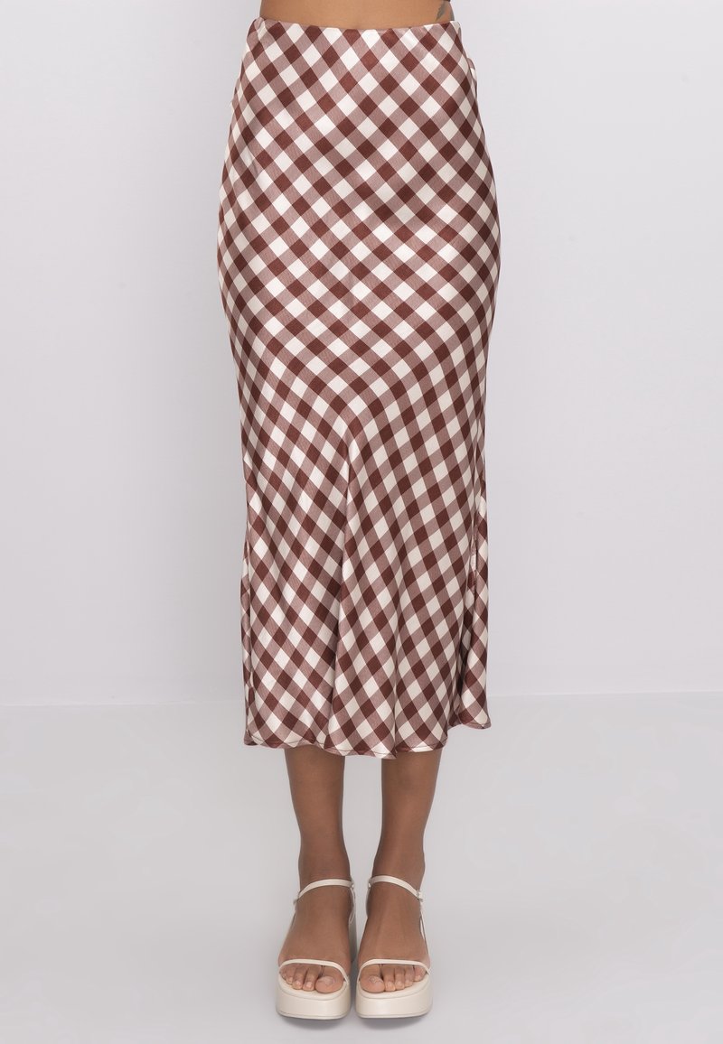 Ruskea-valkoinen ruudullinen midi-hame, jossa on sileä kangas, vartalonmyötäinen vyötärön kohdalla, liehuva helma ja hienovarainen tekstuuri. Yhdistetty korokepohjakenkiin.