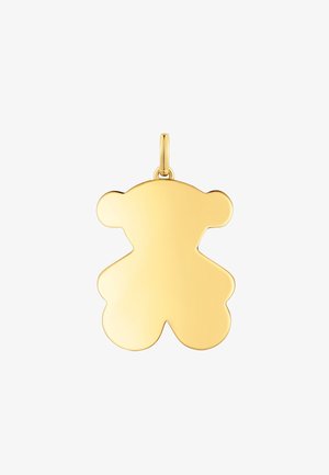 Złoty wisiorek w kształcie niedźwiedzia o gładkiej, lustrzanej powierzchni i małej pętli do mocowania. Prosta konstrukcja z zaokrąglonymi krawędziami.