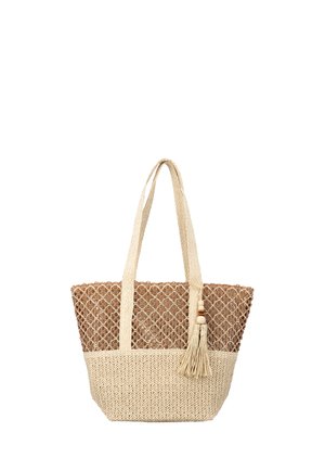 Beige and brown woven tote bag with long handles and a decorative tassel hanging from one strap.