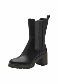 Bottine noire en cuir avec un talon bloc, des panneaux latéraux élastiques et un accent en tissu texturé arborant un logo. Fini lisse et semelle robuste.