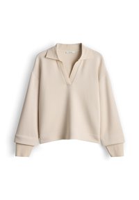 Beige pullovertrui met een V-hals, geribde kraag en brede mouwen. Zachte textuur en cropped ontwerp, met een losse pasvorm.