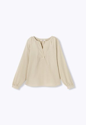 Blouse beige à manches longues avec des rayures blanches verticales, encolure ronde et détails froncés aux épaules et aux poignets. Patte de boutonnage sur le devant.