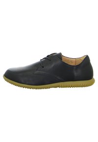 Schwarze Leder Schnürschuhe im Casual-Stil mit beiger Gummisohle und strukturiertem Grip, seitlich von links gezeigt.