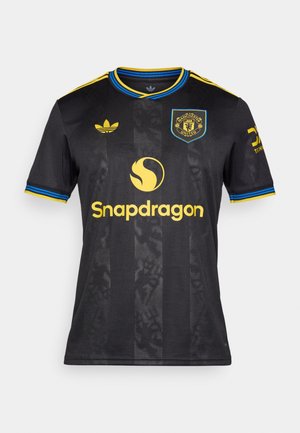 Juodas "Manchester United" marškinėliai su geltonu „Snapdragon“ logotipu, mėlynos ir geltonos spalvos akcentais, „Adidas“ logotipas kairėje peties pusėje, tekstūruoti dryžiai.