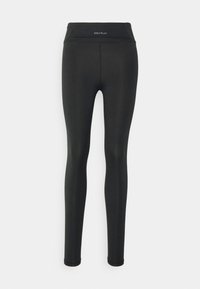 Zwarte legging van rekbare stof. Heeft een hoge tailleband met logo aan de voorkant en een gladde textuur. Klassieke pasvorm. Geen patronen of accenten.
