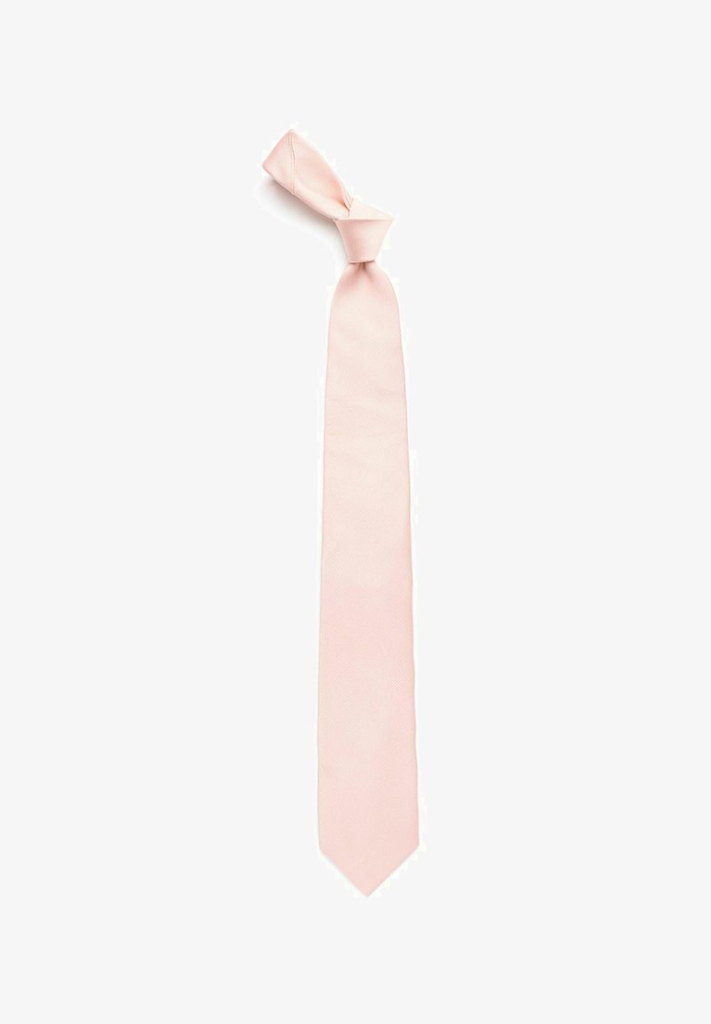 Ljusrosa slips gjord av slät tyg, med en enfärgad design. Slipsen är smal, med en spetsig ände och en knut upptill.
