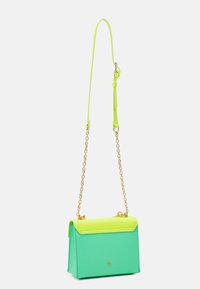 Green and neon yellow handbag made of textured synthetic material, featuring a gold chain strap and a structured, angular design.