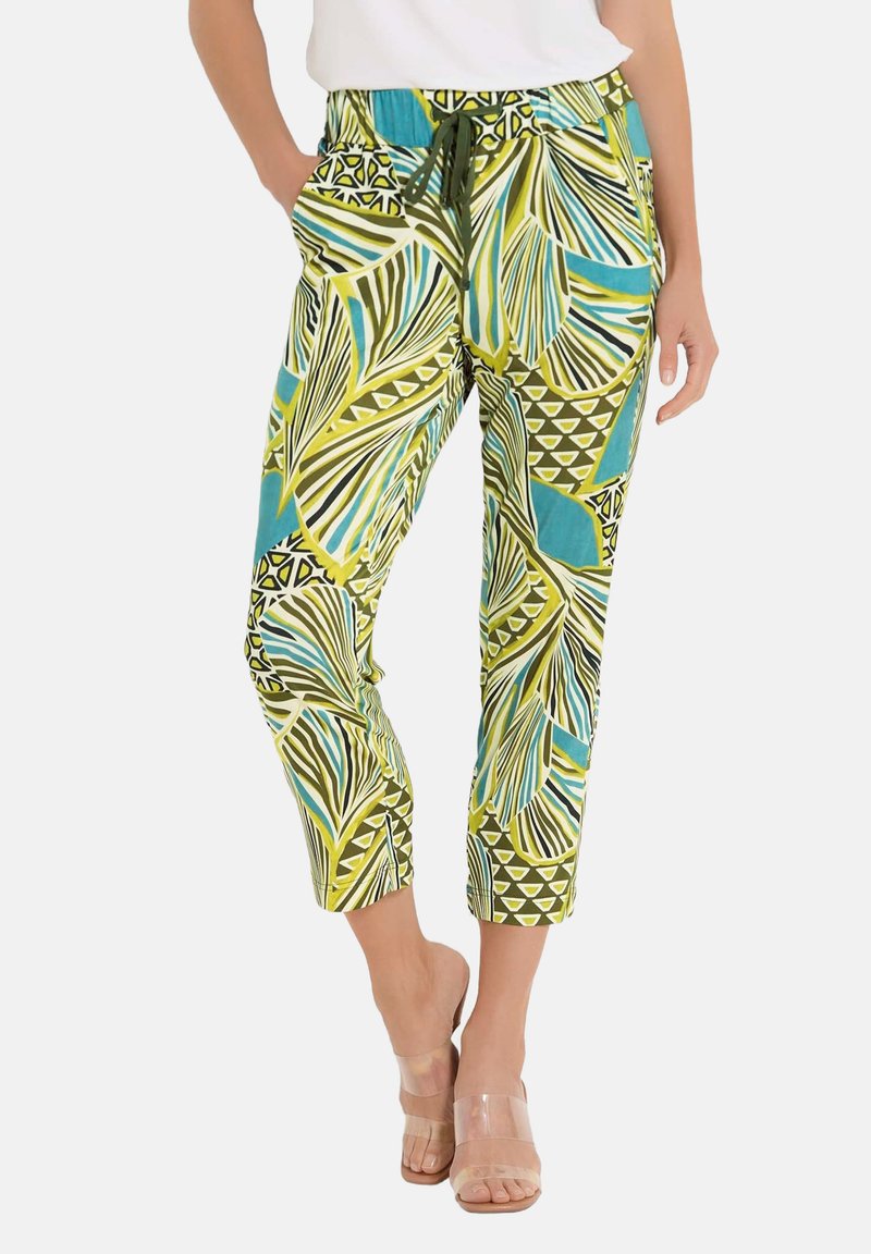 Bunte, gemusterte Hosen mit grünem, gelbem und blauem Blättermuster. Hergestellt aus leichtem Stoff mit einem elastischen Bund und seitlichen Taschen.