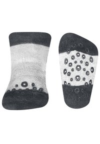 Schwarz-weiße Knöchelsocken mit gestreiftem Muster und strukturiertem, gepunktetem Grip an den Sohlen für zusätzlichen Halt. Dehnbares Strickmaterial.