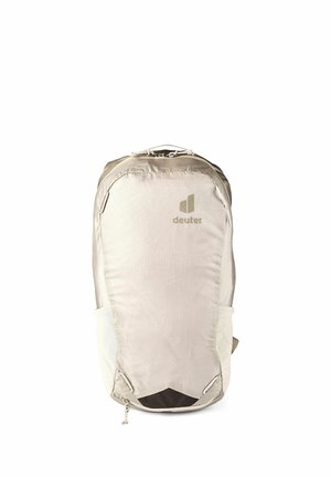 Sac à dos Deuter beige clair avec poche zippée frontale et poches latérales en filet, conçu pour la randonnée ou un usage quotidien.