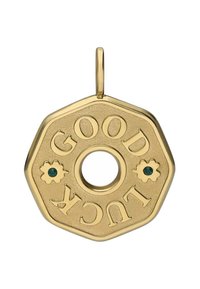Gouden zeshoekige hanger met de gravure "GOOD LUCK", voorzien van een centraal gat en een bloemaccent met een groene steen. Textuur op het oppervlak.