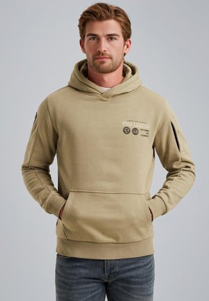 Beige hoodie with a front pocket, drawstring hood, and printed logo details. Features ribbed cuffs and hem, made of soft fabric.