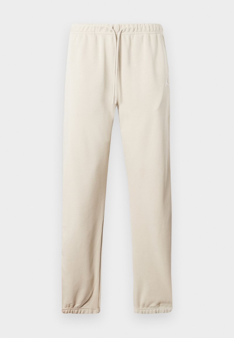 Helle beige Jogginghosen mit elastischem Bund, verstellbarem Kordelzug und Bündchen an den Knöcheln. Mit einem kleinen Logo an der Seite. Weicher Stoff.