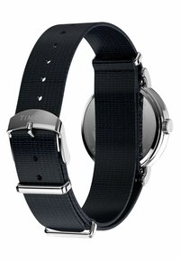 Timex watch features a round silver stainless steel case and a textured black fabric strap with a silver buckle and accents.