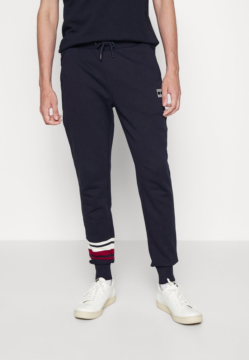 Tommy Hilfiger STRIPE DETAIL Tracksuit bottoms desert sky/dark blue