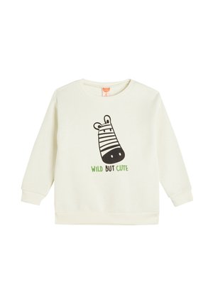 Sudadera de color crema con mangas largas, que presenta un gráfico de cebra negra y texto verde que dice "SALVAJE PERO LINDA" en la parte frontal.