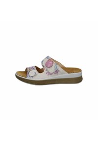 White slide sandal with floral pattern, adjustable straps, cork insole, and textured upper. Features a low wedge sole in neutral color.