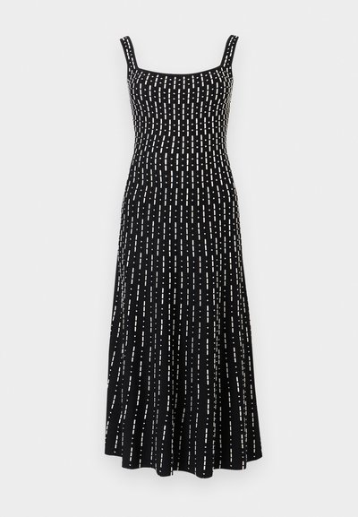 Robe midi noire sans manches avec un décolleté carré et un motif de lignes pointillées blanches verticales sur toute la surface.