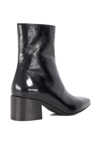 Black leather ankle boot with a pointed toe and a chunky, dark wood block heel. Smooth texture and sleek design with no additional embellishments.