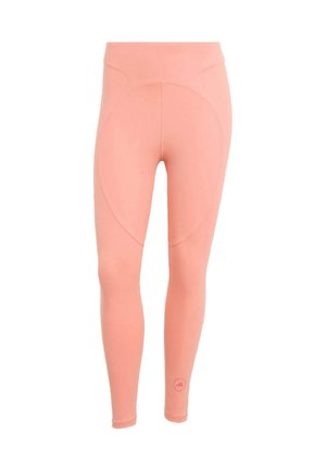 Leggings med høj talje, fuld længde, i ferskenfarve med diskrete sømdetaljer og et lille logo nær bunden af det ene ben.