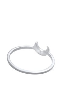 Anneau fin en argent avec une forme de croissant de lune présentant de petites pointes, estampillé "925" et portant une marque de fabricant sur la courbe intérieure.