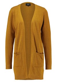Senfgelber Cardigan mit lockerer Passform, offenem Vorderteil und zwei vorderen Taschen. Die Textur ist weich, mit einem gerippten Finish an den Bündchen.