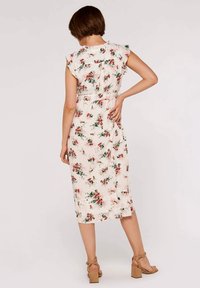 Floral midi dress with short ruffled sleeves, a cinched waist, and a light cream background featuring red and green floral patterns.
