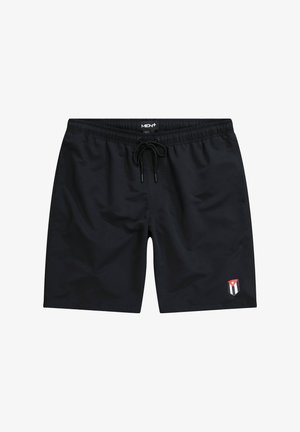 Schwarze Badehosen mit einem elastischen Bund und Kordelzug. Mit einem kleinen Logo-Patch mit roten, weißen und blauen Akzenten an der Seite.