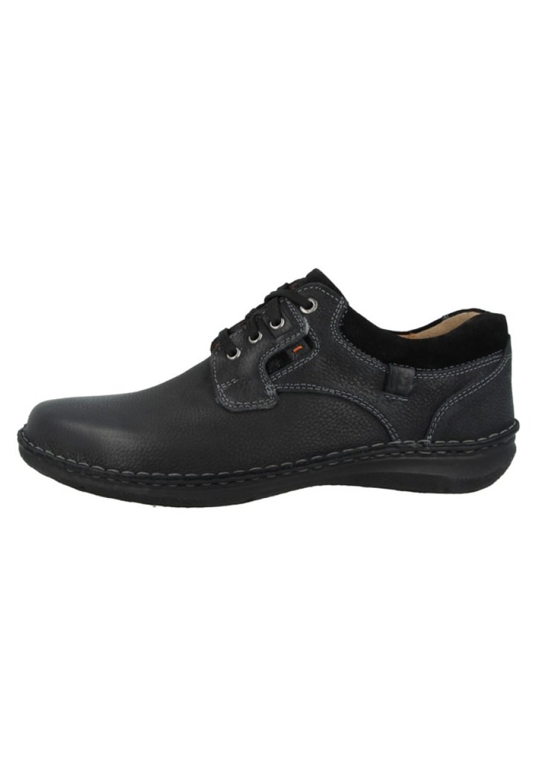 Scarpa in pelle nera con punta arrotondata, design con lacci, cuciture a contrasto e colletto morbido. Presenta un'esterno testurizzato e una suola imbottita.