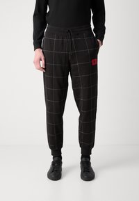 HUGO DRAG - Träningsbyxor - black