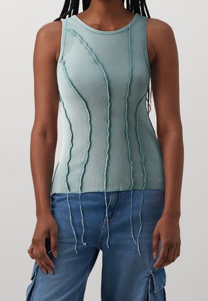 Ribbed aqua tank top with textured detailing and elongated threads at the hem. Sleeveless design with a round neckline.