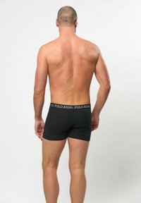 Svarta boxerbriefs med ett elastiskt midjeband från U.S. Polo Assn. Tyget ser slätt och åtsittande ut, med en minimalistisk design.