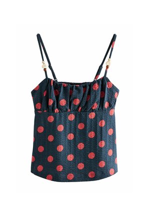 Top fără mâneci bleumarin cu buline roșii, piept plisat, bretele subțiri reglabile și mărgele decorative pe bretele.