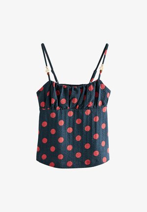 Top fără mâneci bleumarin cu buline roșii, piept plisat, bretele subțiri reglabile și mărgele decorative pe bretele.