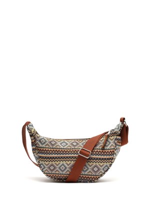 Boho-style crescent-shaped fabric shoulder bag with geometric patterns and an adjustable brown strap and zipper closure.